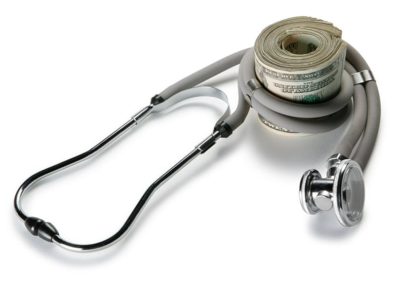 A-roll-of-money-with-a-stethoscope-around-it. Representing the ability to provide quality care and save money.