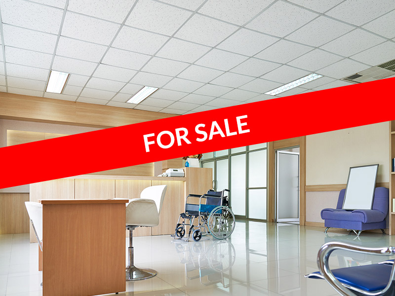 Physician-practice-with-no-patients-and-a-For-Sale-sign
