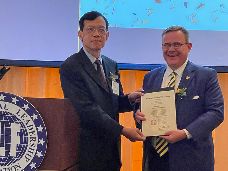 Dr.-Siu-Shing-Tong-receiving-a-Certificate-of-Recognition-from-the-North-Carolina-Speaker-of-the-House-Tim-Moore.